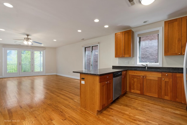 25 E 26th St Unit 4, Chicago, IL 60616 - kitchen featuring stainless steel dishwasher, a peninsula, a sink, light wood finished floors, and recessed lighting