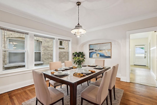 217 S Oak Park Ave, Oak Park, IL 60302 - dining area featuring a chandelier, crown molding, and wood finished floors