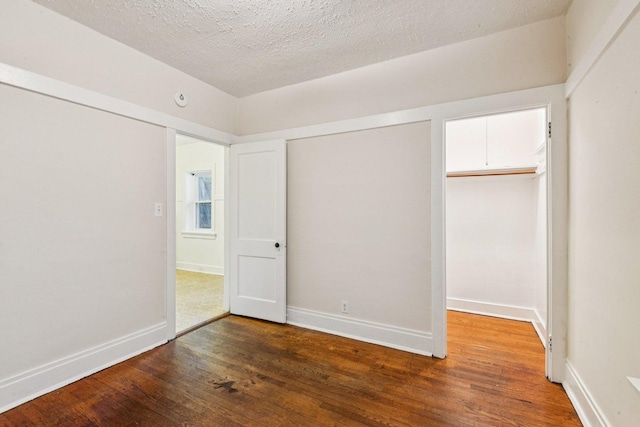 217 S Oak Park Ave, Oak Park, IL 60302 - unfurnished bedroom featuring wood finished floors and a textured ceiling