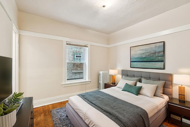 217 S Oak Park Ave, Oak Park, IL 60302 - bedroom featuring radiator and wood finished floors