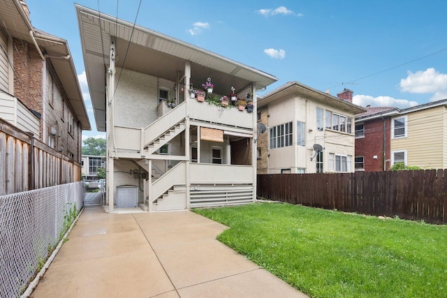 217 S Oak Park Ave, Oak Park, IL 60302 - back of house with stairs and brick siding