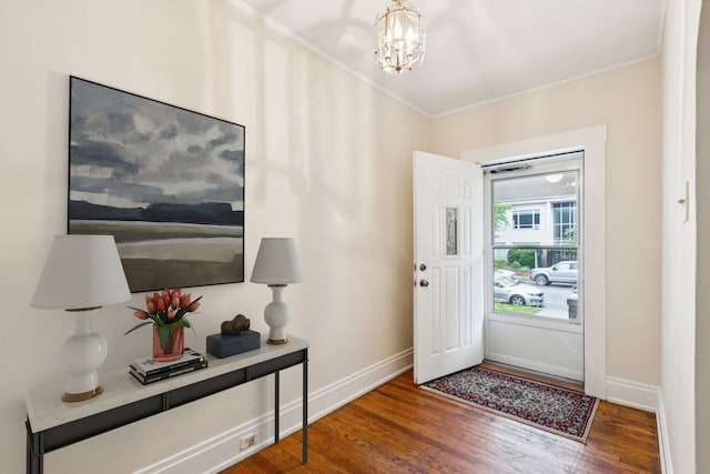 217 S Oak Park Ave, Oak Park, IL 60302 - entrance foyer with wood finished floors, crown molding, and a chandelier