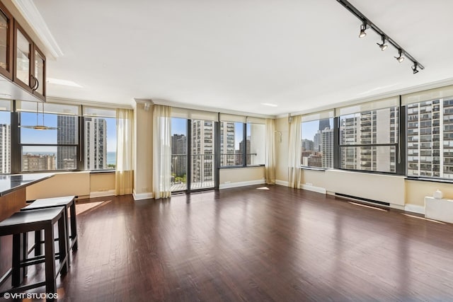 1560 N Sandburg Ter Unit 2202, Chicago, IL 60610 - unfurnished room with a city view, track lighting, wood finished floors, and baseboards