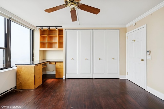 1560 N Sandburg Ter Unit 2202, Chicago, IL 60610 - unfurnished office featuring dark wood-type flooring, ceiling fan, built in desk, baseboards, and crown molding