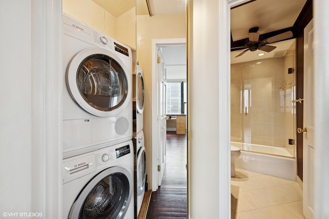 1560 N Sandburg Ter Unit 2202, Chicago, IL 60610 - washroom featuring stacked washer / drying machine, a ceiling fan, and tile patterned flooring
