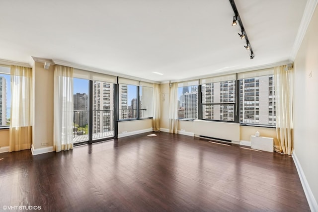 1560 N Sandburg Ter Unit 2202, Chicago, IL 60610 - unfurnished room featuring track lighting, wood finished floors, a view of city, ornamental molding, and baseboards