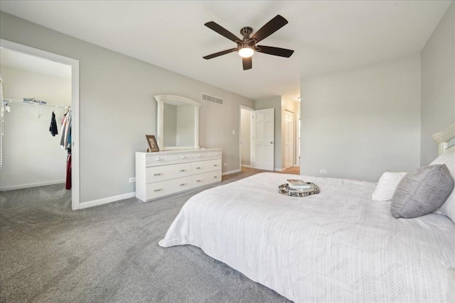 616 Meadowview Dr, West Chicago, IL 60185 - carpeted bedroom featuring baseboards, a walk in closet, a ceiling fan, and a closet
