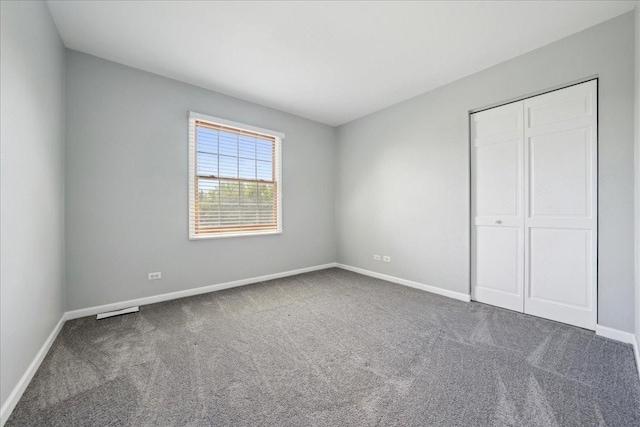 616 Meadowview Dr, West Chicago, IL 60185 - unfurnished bedroom with carpet, baseboards, and a closet