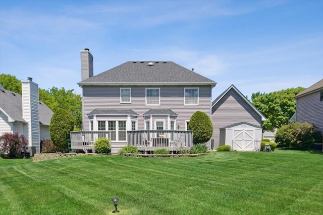 616 Meadowview Dr, West Chicago, IL 60185 - rear view of property with a lawn, a deck, and a chimney