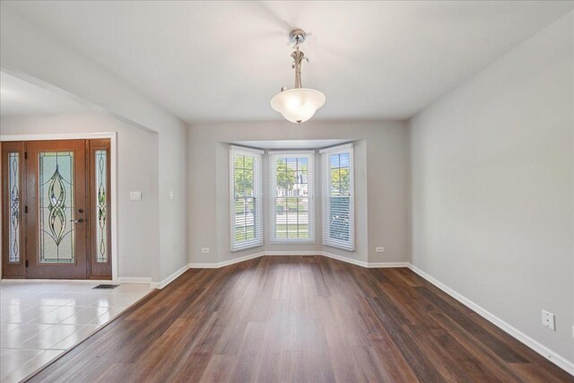 616 Meadowview Dr, West Chicago, IL 60185 - foyer entrance featuring baseboards and wood finished floors