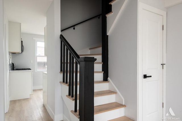 26415 W Beach St, Antioch, IL 60002 - staircase with wood finished floors and baseboards