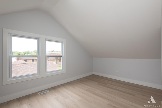 26415 W Beach St, Antioch, IL 60002 - additional living space featuring lofted ceiling, light wood finished floors, and baseboards