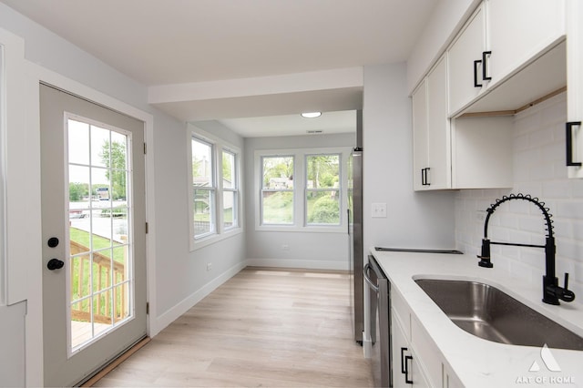 26415 W Beach St, Antioch, IL 60002 - kitchen with a sink, healthy amount of natural light, stainless steel dishwasher, and white cabinets