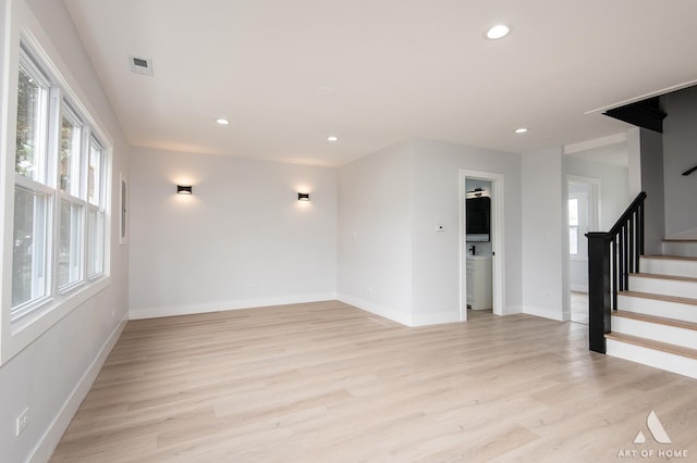 26415 W Beach St, Antioch, IL 60002 - empty room with healthy amount of natural light, stairs, light wood-style flooring, baseboards, and recessed lighting