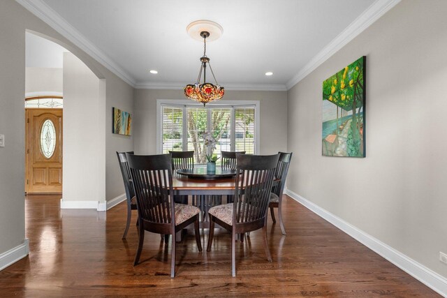 6312 Kingsbridge Dr, Cary, IL 60013 - dining room with arched walkways, dark wood-style flooring, recessed lighting, and ornamental molding