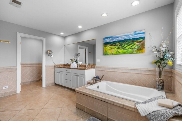 6312 Kingsbridge Dr, Cary, IL 60013 - bathroom featuring vanity, a garden tub, recessed lighting, tile patterned flooring, and a wainscoted wall