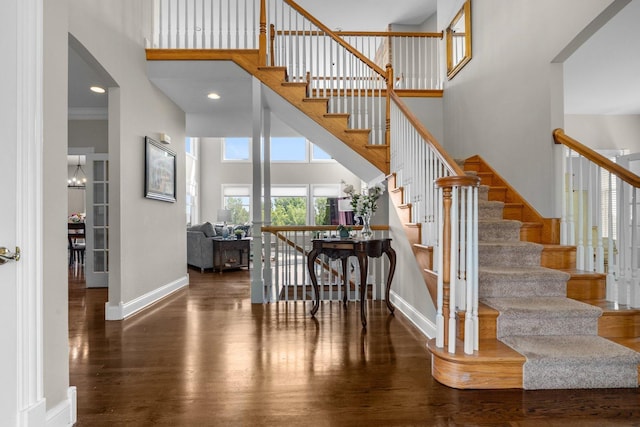 6312 Kingsbridge Dr, Cary, IL 60013 - stairway with a towering ceiling and wood finished floors