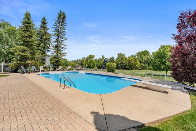6312 Kingsbridge Dr, Cary, IL 60013 - view of pool with a patio area, a diving board, and view of scattered trees