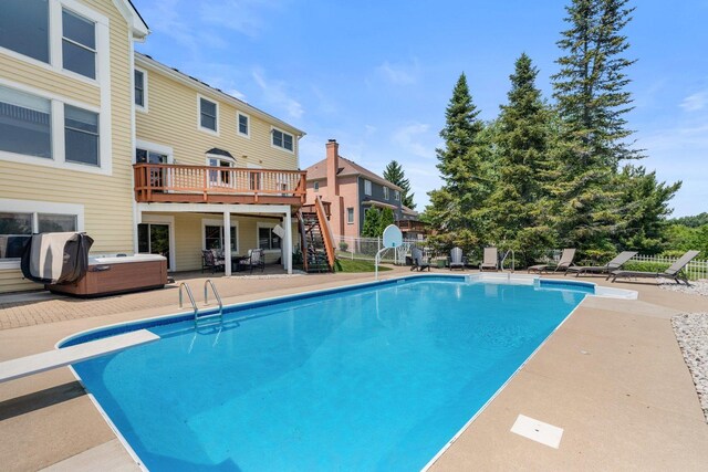 6312 Kingsbridge Dr, Cary, IL 60013 - view of swimming pool featuring a hot tub, stairway, a patio area, a diving board, and a deck