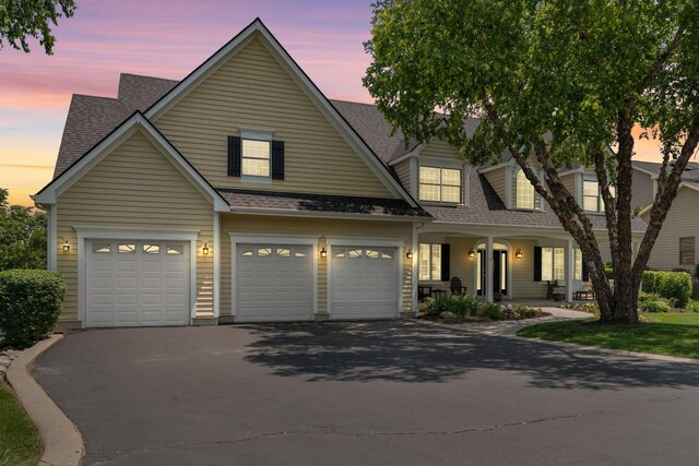 6312 Kingsbridge Dr, Cary, IL 60013 - view of front of house with asphalt driveway, a porch, and roof with shingles