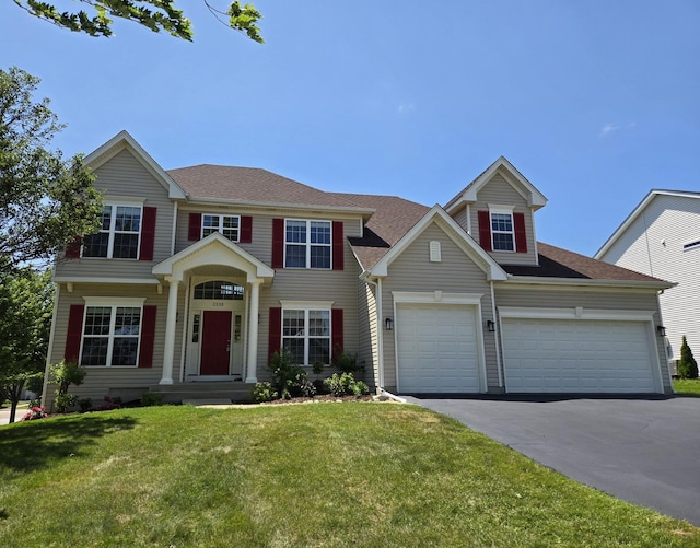 2333 Roaring Creek Dr, Aurora, IL 60503 - view of front facade with driveway, a front yard, a shingled roof, and a garage