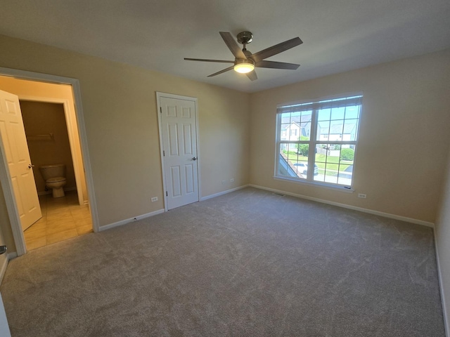 2333 Roaring Creek Dr, Aurora, IL 60503 - unfurnished bedroom featuring carpet floors, connected bathroom, and a ceiling fan