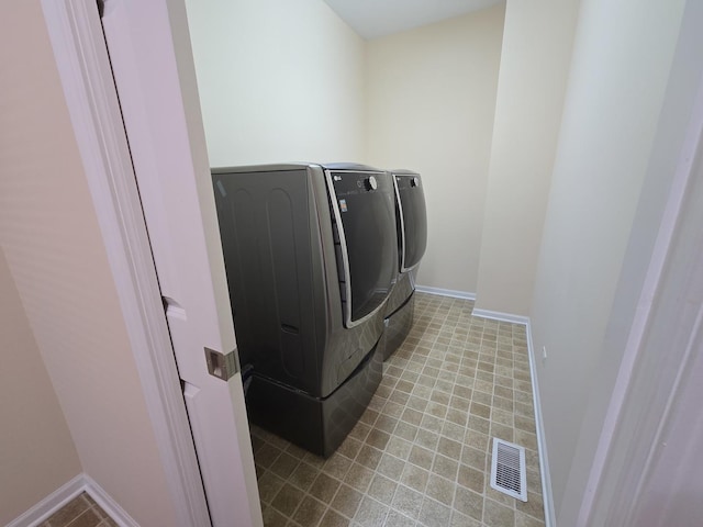 2333 Roaring Creek Dr, Aurora, IL 60503 - washroom featuring separate washer and dryer and baseboards