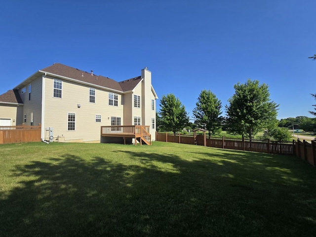 2333 Roaring Creek Dr, Aurora, IL 60503 - rear view of house with a fenced backyard, a chimney, a deck, and stairway