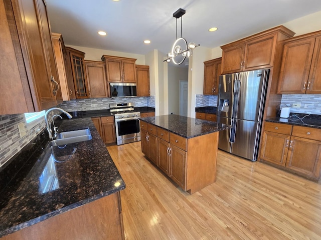 2333 Roaring Creek Dr, Aurora, IL 60503 - kitchen with stainless steel appliances, backsplash, brown cabinetry, light wood finished floors, and recessed lighting