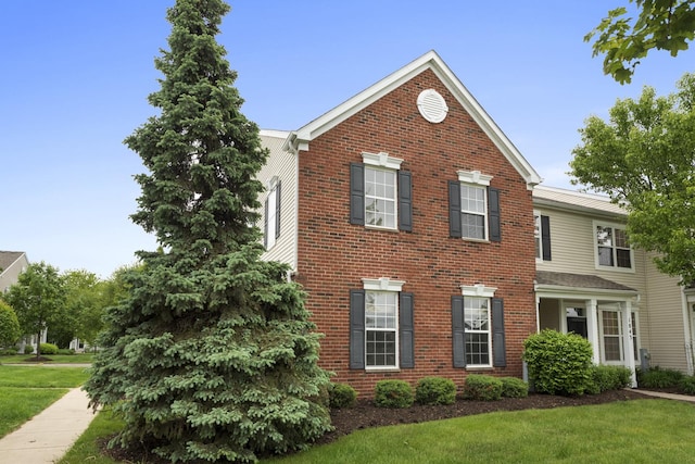 1841 Havens Dr, Woodstock, IL 60098 - view of front facade with a front lawn and brick siding