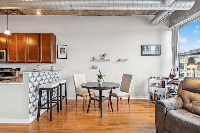 1069 W 14th Pl Unit 333, Chicago, IL 60608 - dining space featuring light wood finished floors and baseboards