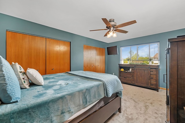 26138 Oak Ridge Ct, Channahon, IL 60410 - bedroom featuring light colored carpet, two closets, and a ceiling fan