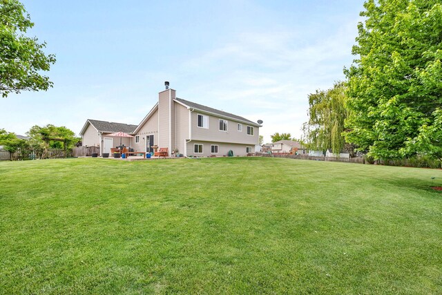26138 Oak Ridge Ct, Channahon, IL 60410 - rear view of house with a chimney