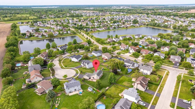 26138 Oak Ridge Ct, Channahon, IL 60410 - aerial view of property and surrounding area featuring a large body of water and nearby suburban area