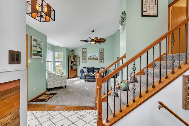 26138 Oak Ridge Ct, Channahon, IL 60410 - foyer entrance featuring wood finished floors, lofted ceiling, a ceiling fan, and stairway