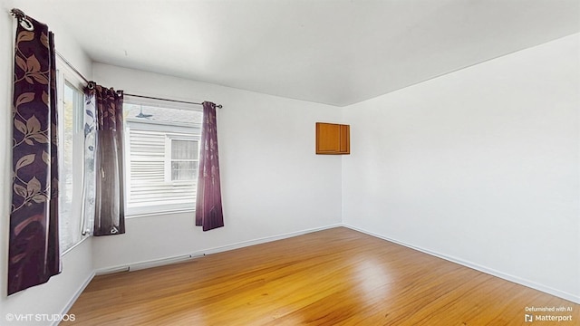 6145 S Nashville Ave, Chicago, IL 60638 - unfurnished room featuring light wood-style floors and baseboards