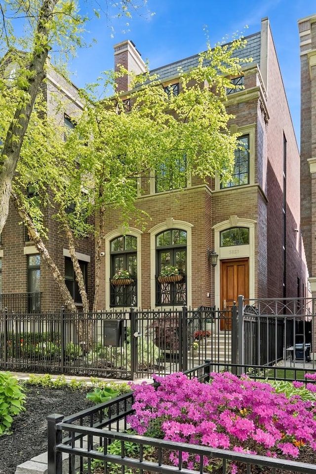 3823 N Wayne Ave, Chicago, IL 60613 - view of front of home featuring a fenced front yard and brick siding