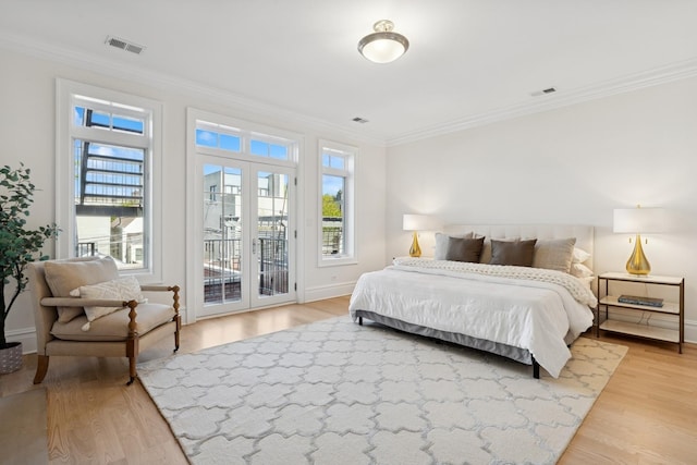 3823 N Wayne Ave, Chicago, IL 60613 - bedroom featuring crown molding, access to outside, light wood-type flooring, french doors, and baseboards
