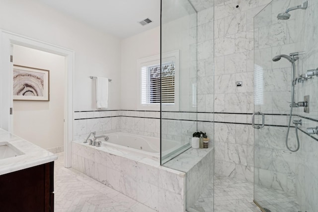 3823 N Wayne Ave, Chicago, IL 60613 - full bathroom featuring a tub with jets, a marble finish shower, and vanity