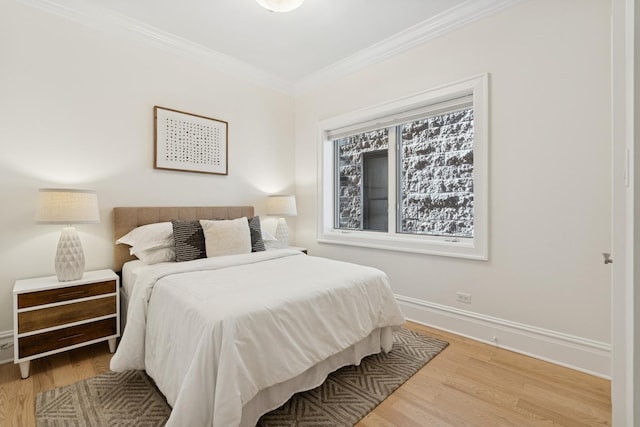 3823 N Wayne Ave, Chicago, IL 60613 - bedroom featuring ornamental molding, wood finished floors, and baseboards