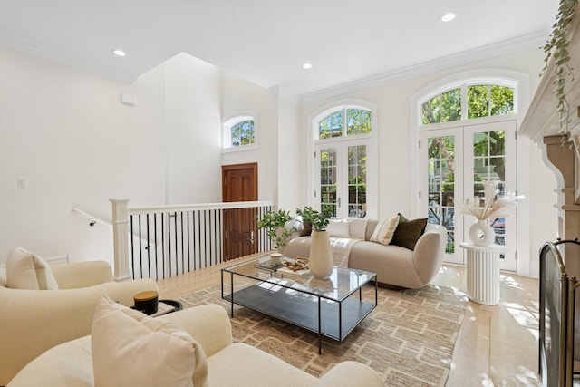3823 N Wayne Ave, Chicago, IL 60613 - living room featuring crown molding, recessed lighting, a towering ceiling, french doors, and light wood-style flooring