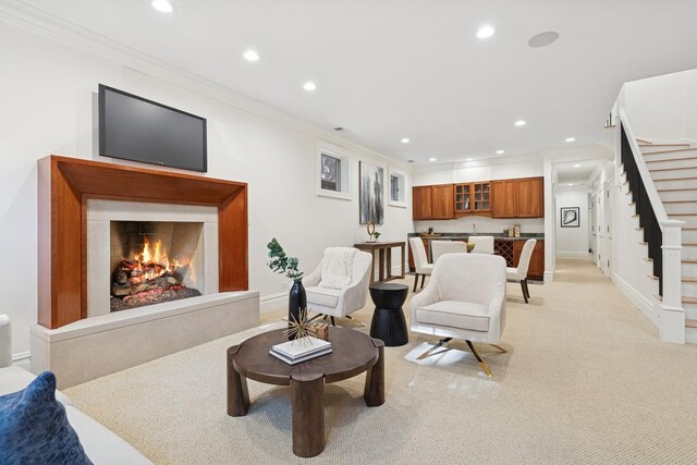 3823 N Wayne Ave, Chicago, IL 60613 - living room with stairway, recessed lighting, a warm lit fireplace, crown molding, and baseboards