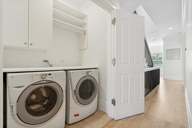 3823 N Wayne Ave, Chicago, IL 60613 - washroom with washer and dryer, baseboards, and light wood-type flooring