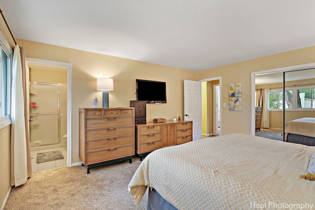 4125 Victoria Dr, Hoffman Estates, IL 60192 - carpeted bedroom featuring a closet, baseboards, and ensuite bathroom