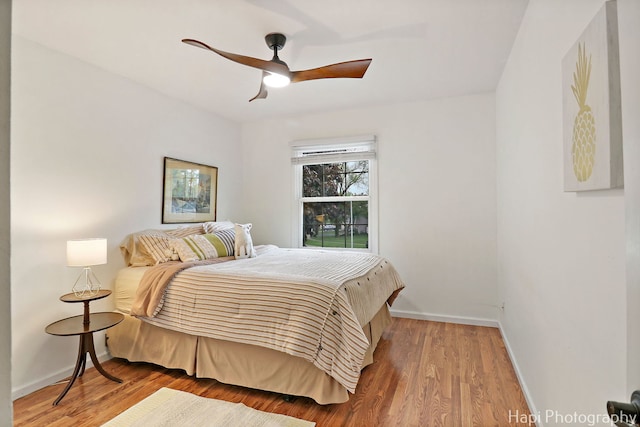 4125 Victoria Dr, Hoffman Estates, IL 60192 - bedroom with baseboards, wood finished floors, and a ceiling fan
