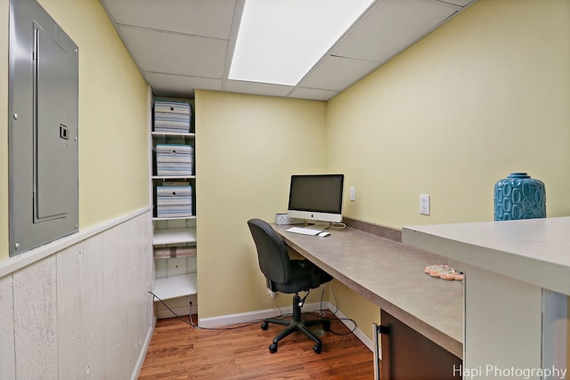 4125 Victoria Dr, Hoffman Estates, IL 60192 - office featuring electric panel, a paneled ceiling, wood finished floors, and a wainscoted wall