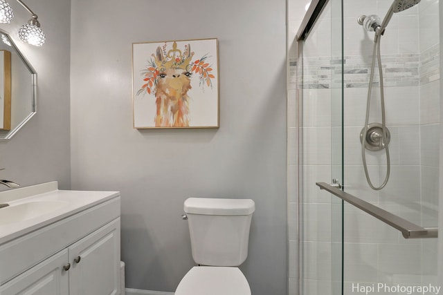 4125 Victoria Dr, Hoffman Estates, IL 60192 - bathroom featuring a tile shower, toilet, and vanity