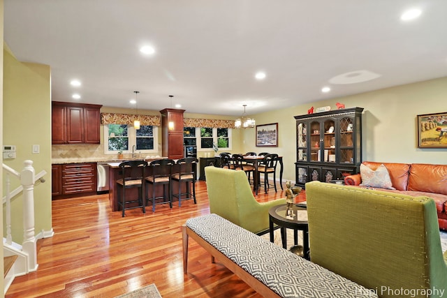 4125 Victoria Dr, Hoffman Estates, IL 60192 - living area featuring light wood finished floors, a chandelier, and recessed lighting