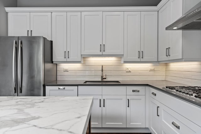 1429 S Prairie Ave, Chicago, IL 60605 - kitchen with appliances with stainless steel finishes, a sink, wall chimney exhaust hood, and white cabinetry