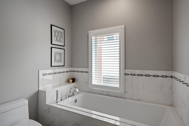 1429 S Prairie Ave, Chicago, IL 60605 - full bathroom with toilet, a garden tub, and plenty of natural light